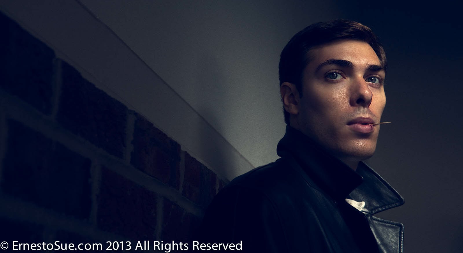 Alex Veach (Alexander Veach) Drive-inspired editorial portrait, leather jacket, toothpick, cinematic noir lighting.