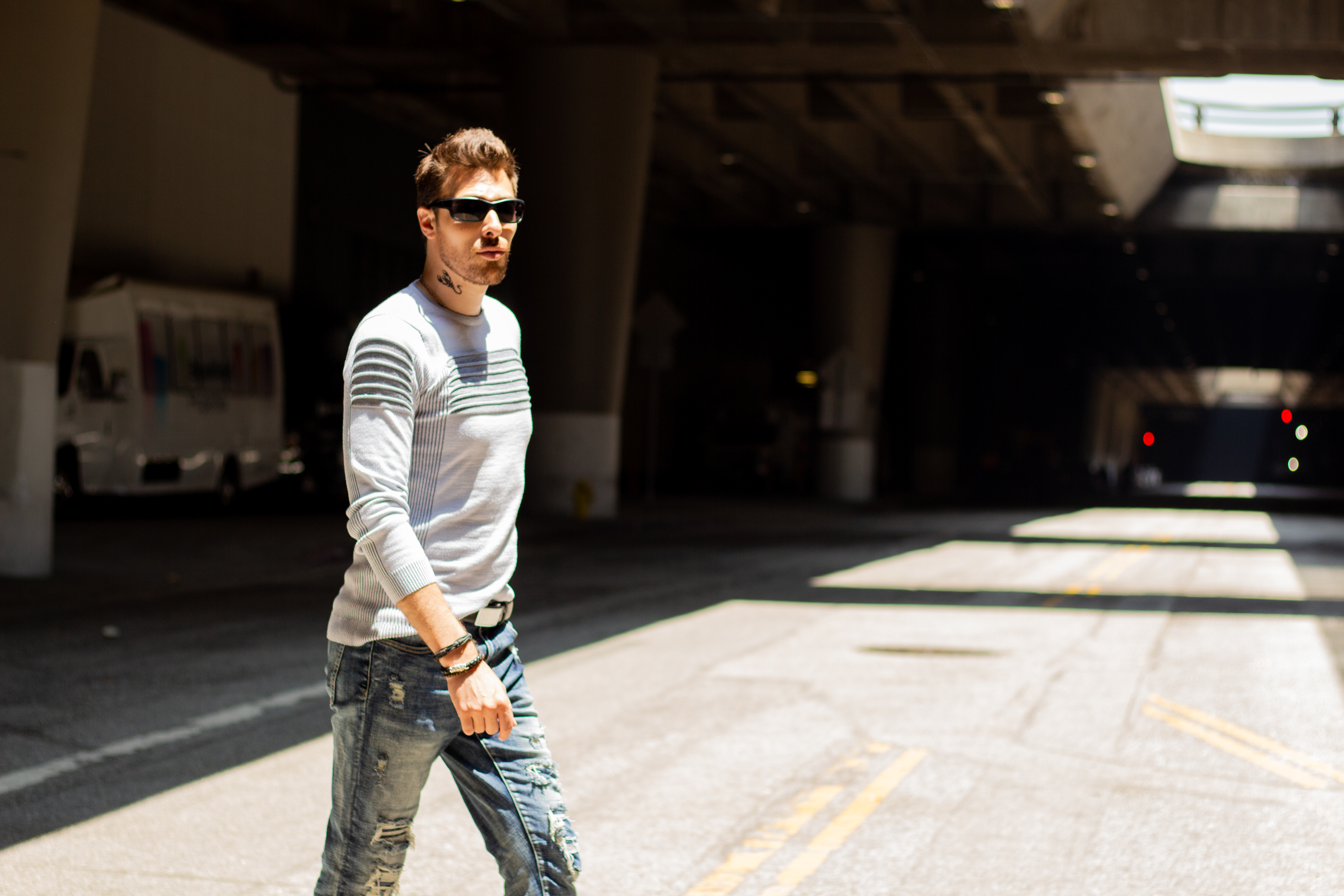 Alex Veach (Alexander Veach) DTLA street style, striped sweater crossing underpass.