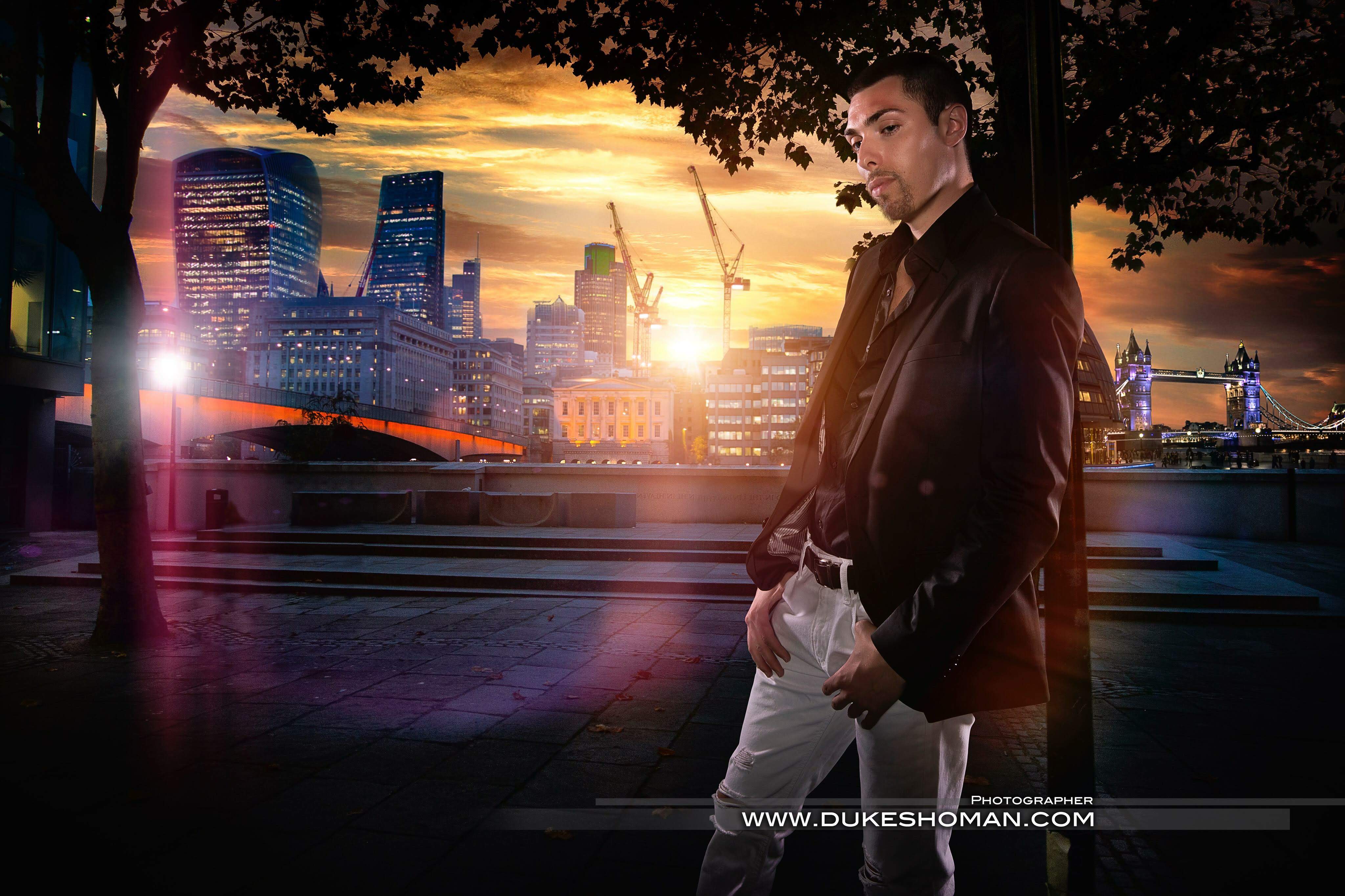Alex Veach (Alexander Veach) cinematic London skyline composite, dark blazer and white jeans.