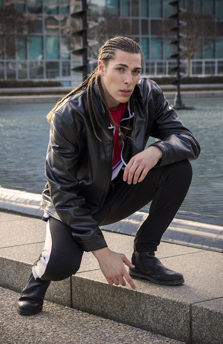 Alex Veach (Alexander Veach) crouching editorial pose at La Defense, Paris.
