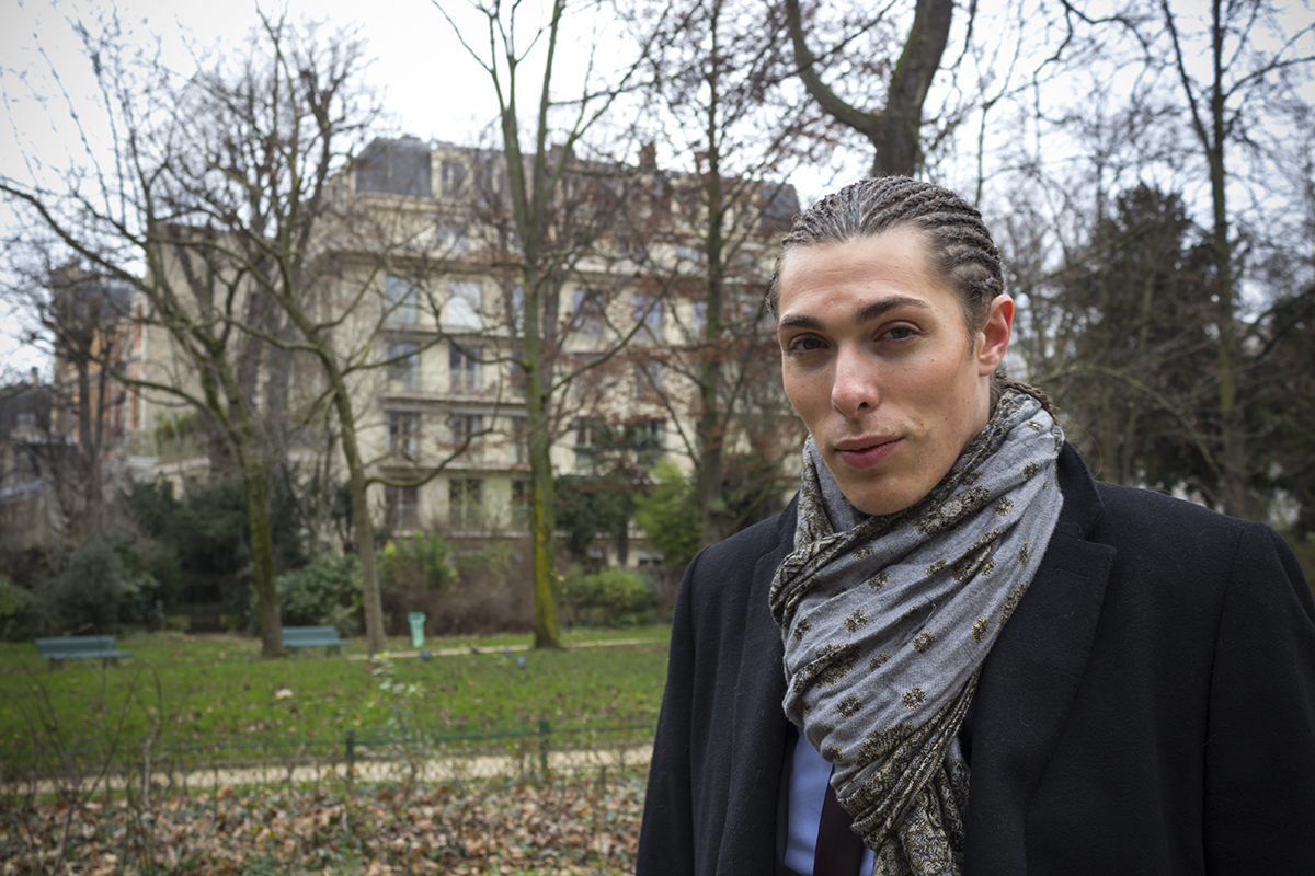 Alex Veach (Alexander Veach) Paris park portrait with Haussmann architecture backdrop.