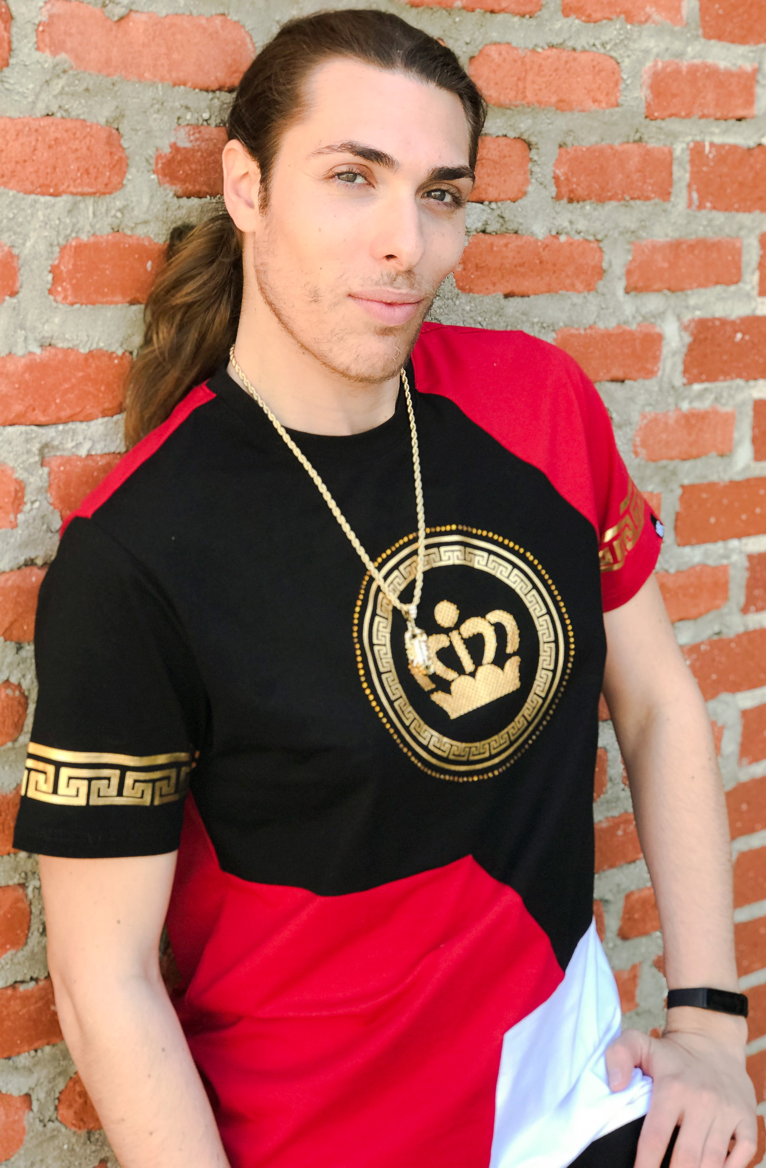 Alex Veach (Alexander Veach) LA streetwear close-up, crown graphic tee on brick wall.