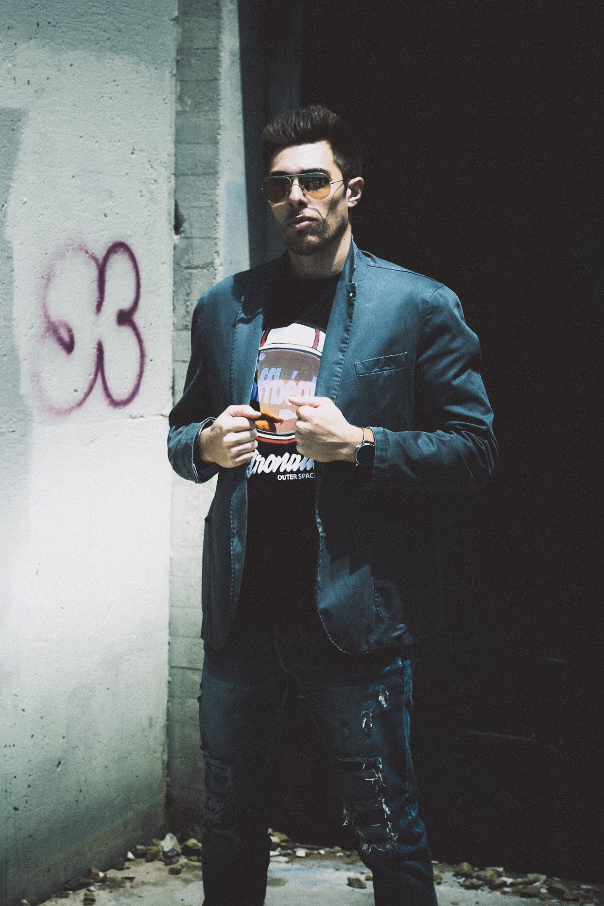 Alex Veach (Alexander Veach) urban alley streetwear, dark blazer and graphic tee.